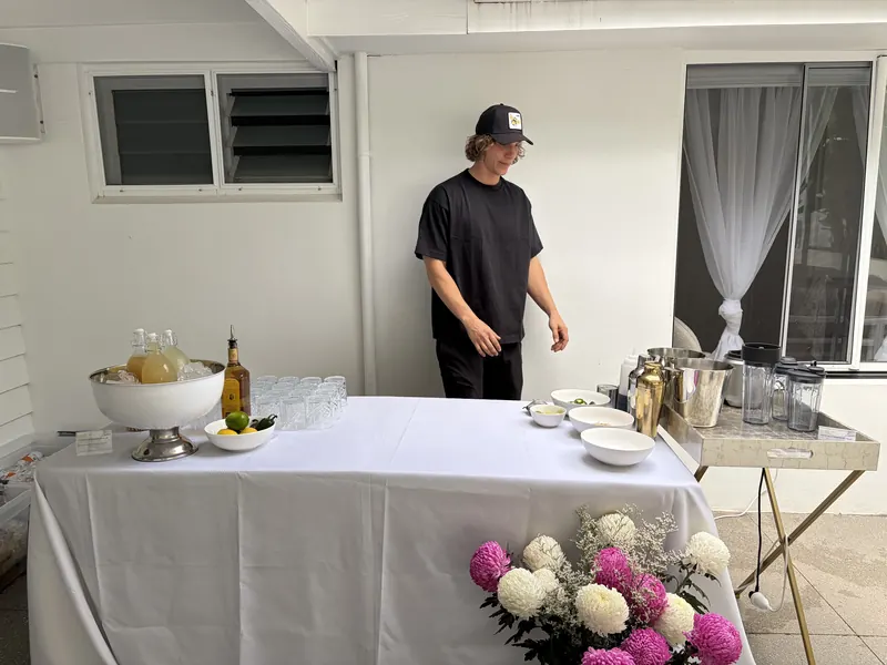Ollie setting up the bar before guests arrive